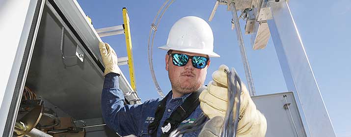 UniSource employee working on electrical grid
